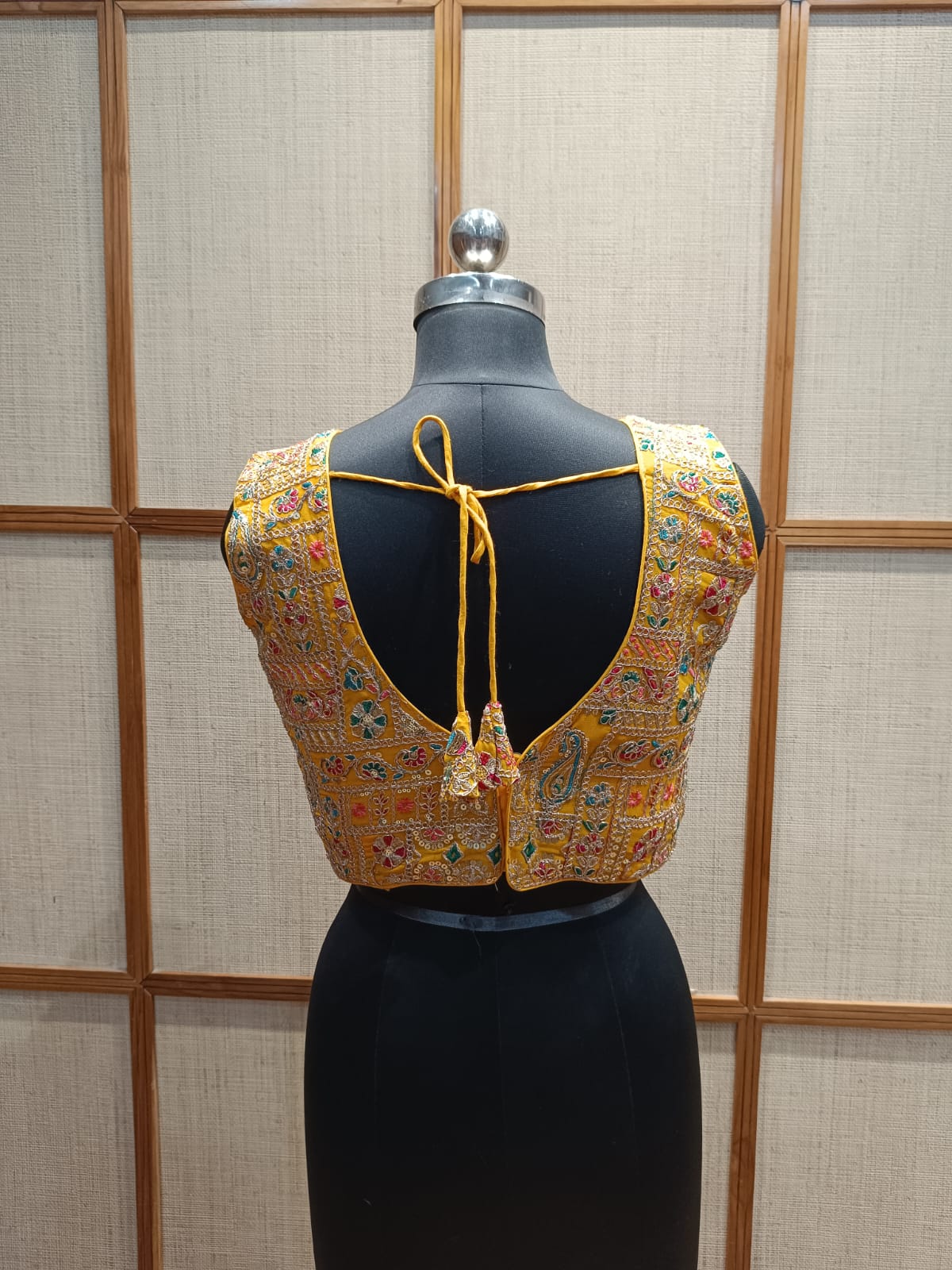 Traditional embroidered blouse back side with a dori